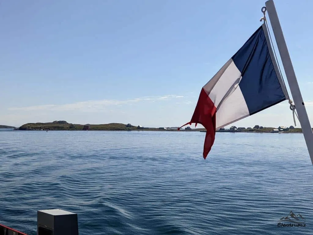 view from the SPM Ferry with the French flag floating in the wind