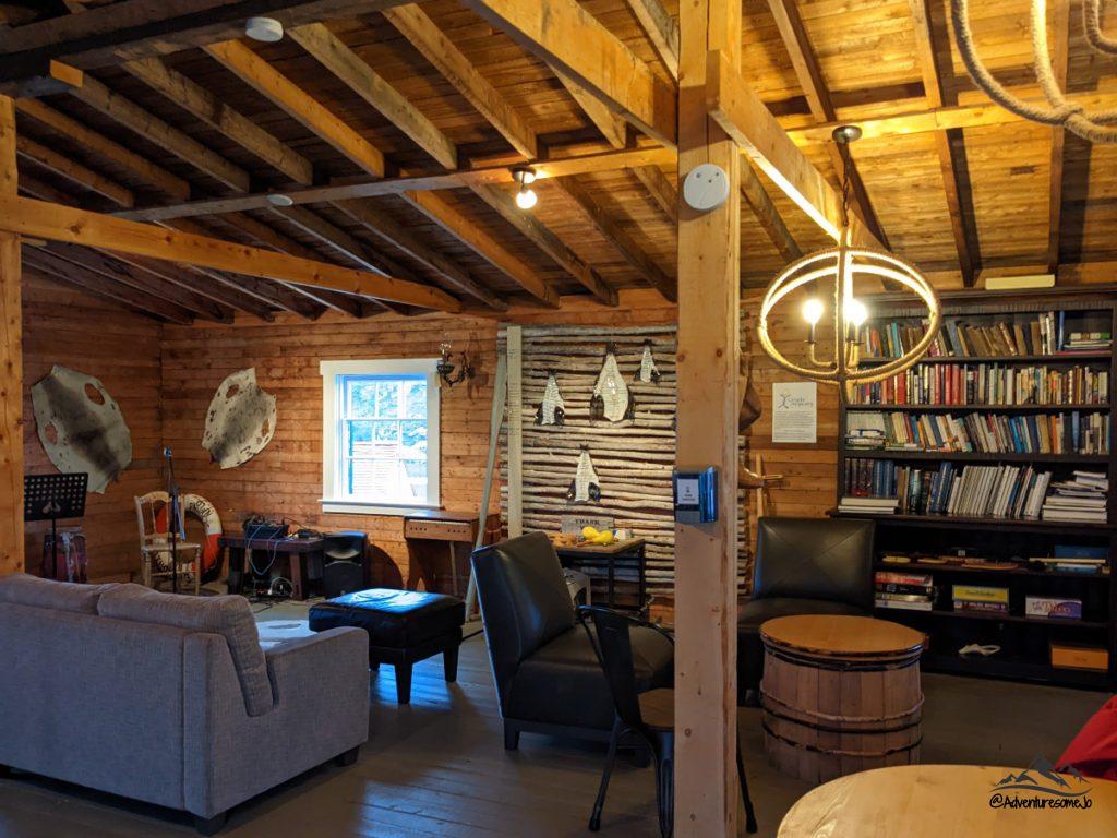 couches and comfy chairs with a wall bookcase