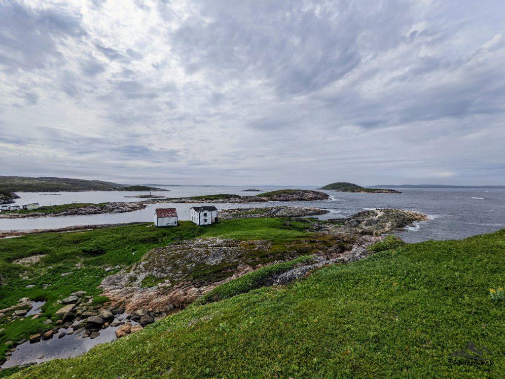 View of two abandoned houses from the hiking trail on Battle Island