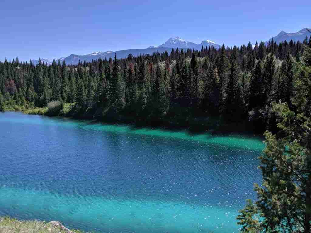 Emerald blue lake on the Valley of the 5 Lakes Trail