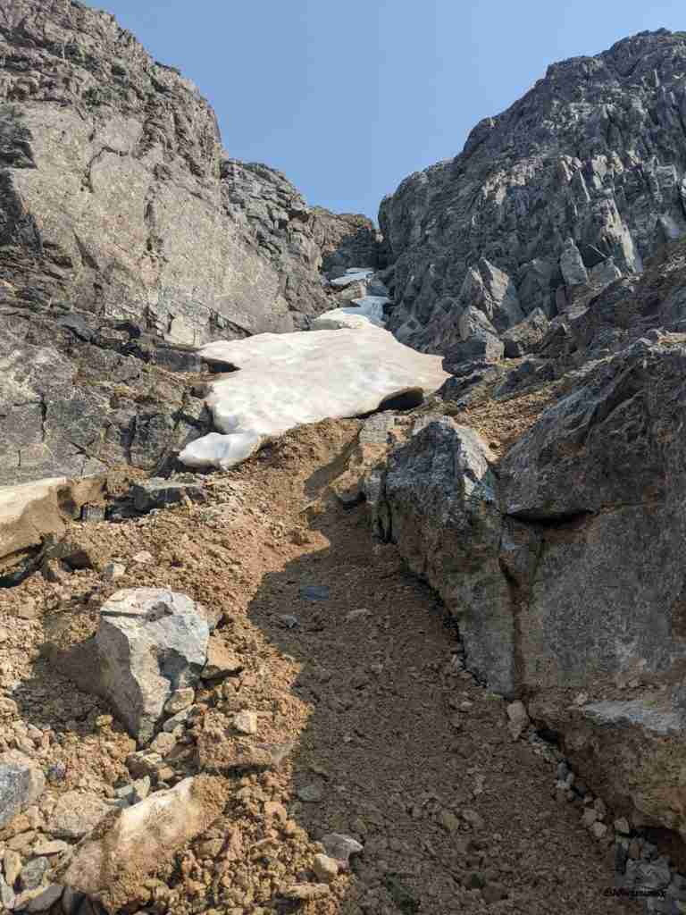 crossing a ravine on Mount Temple
