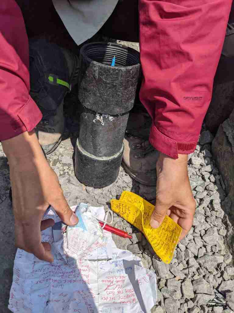 Messages by previous hikers and scramblers on Mount Temple's summit