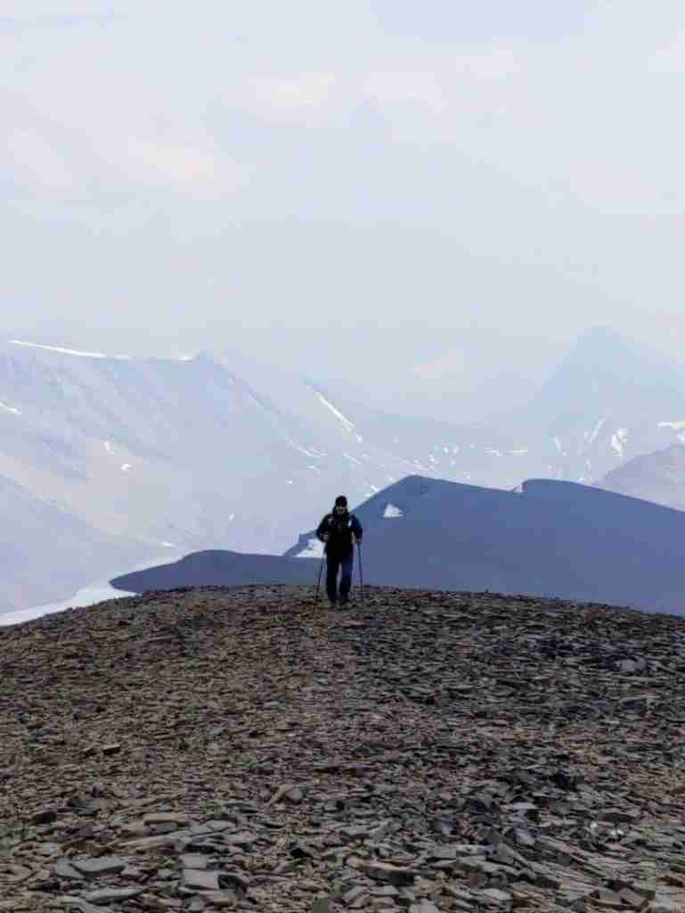 hiking on a loose rocks trail to Tangle Ridge in the Canadian Rockies