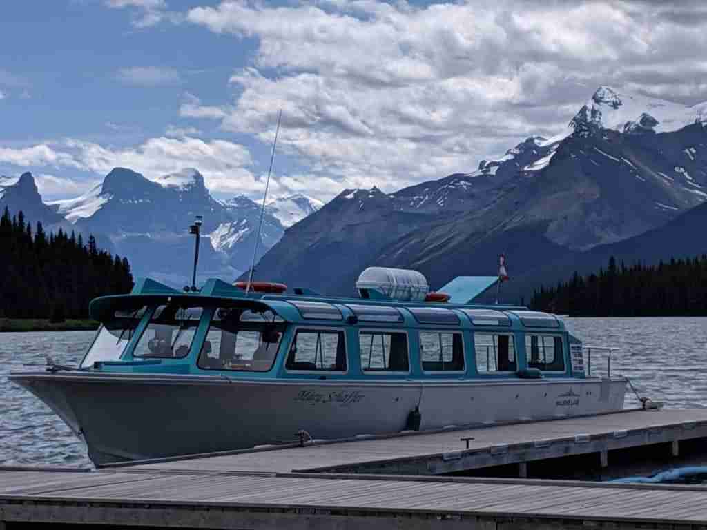 boat from the Maligne Tours docked on Maligne Lake