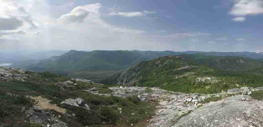 view of the surrounding grassy mountains from the summit of mont du lac à l'empêche et du four