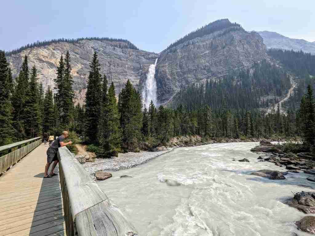 Standing over the bridge with Takakkaw Falls in the distance in Yoho National Park