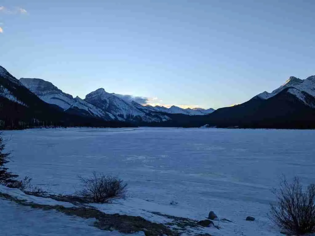 View of Spray Lake Reservoir and surrounding mountains from the Three Sisters Parkway in winer in Canmore