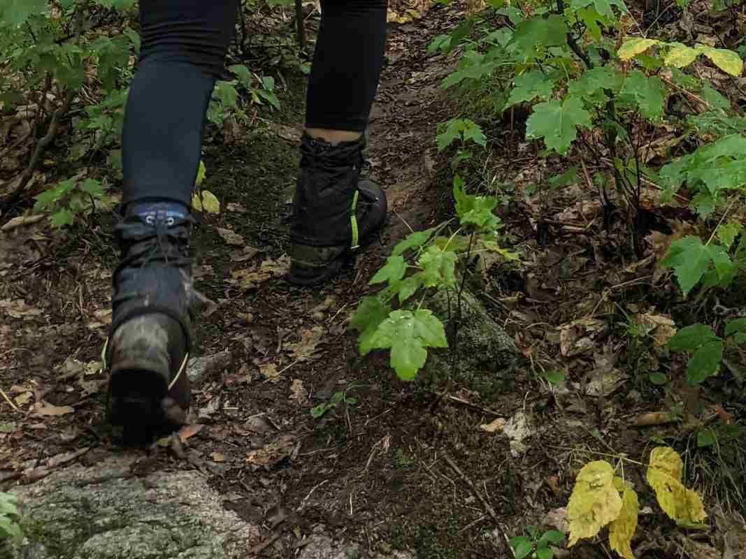 wearing gaters on the trail in wet conditions