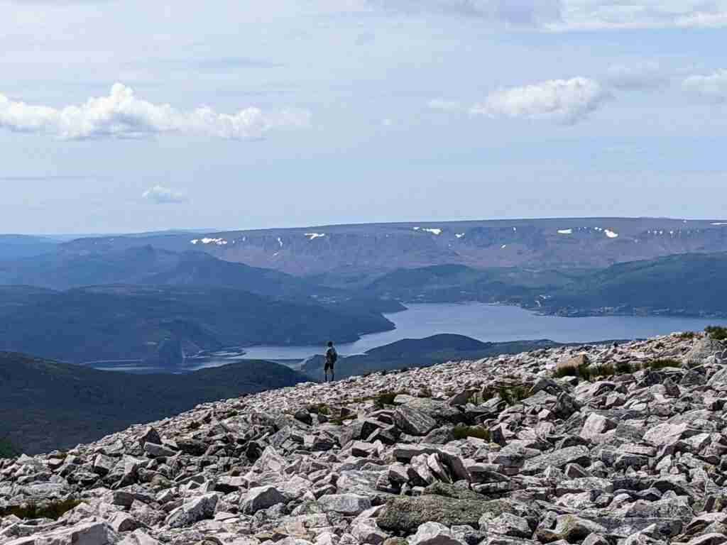 Standing on the summit of Gros Morne Mountain
