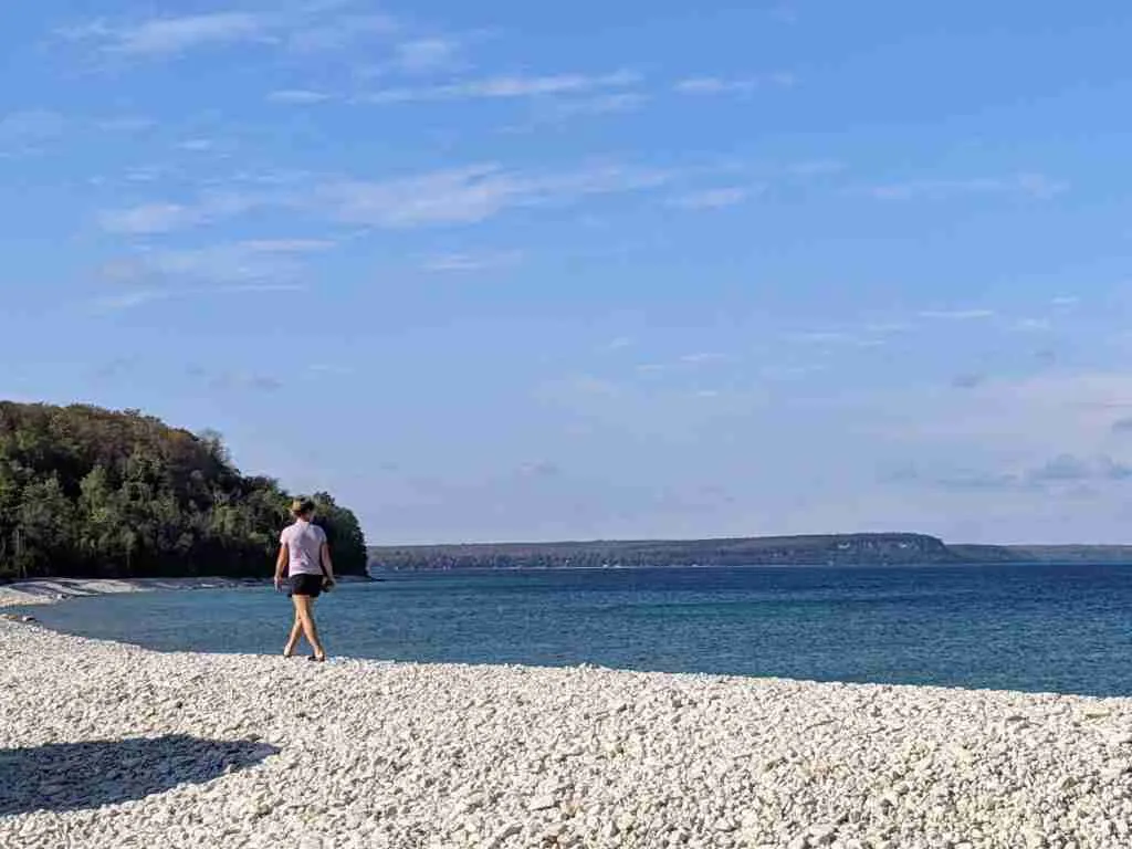 walking on the white pebble beach in Lion's Head