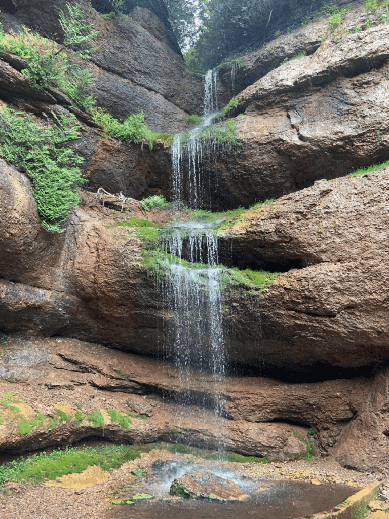 water cascading down the rocks in The Grotte