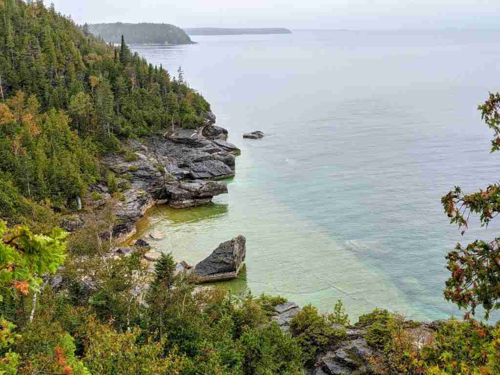 View of the clear water of Georgian Bay from the hiking trail in Bruce Peninsula National park