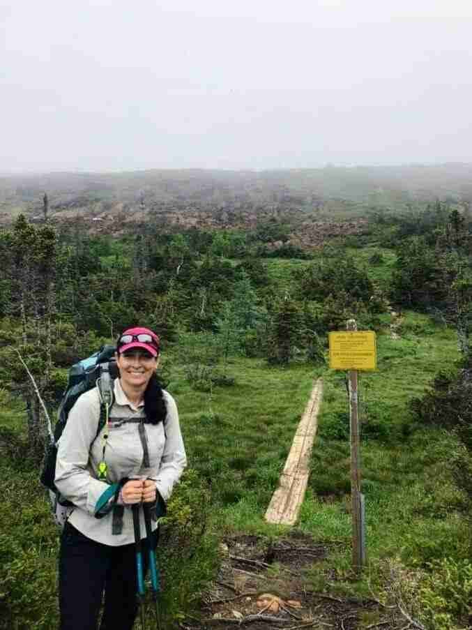 hiker showing the best clothes for hiking in summer to protect from the sun