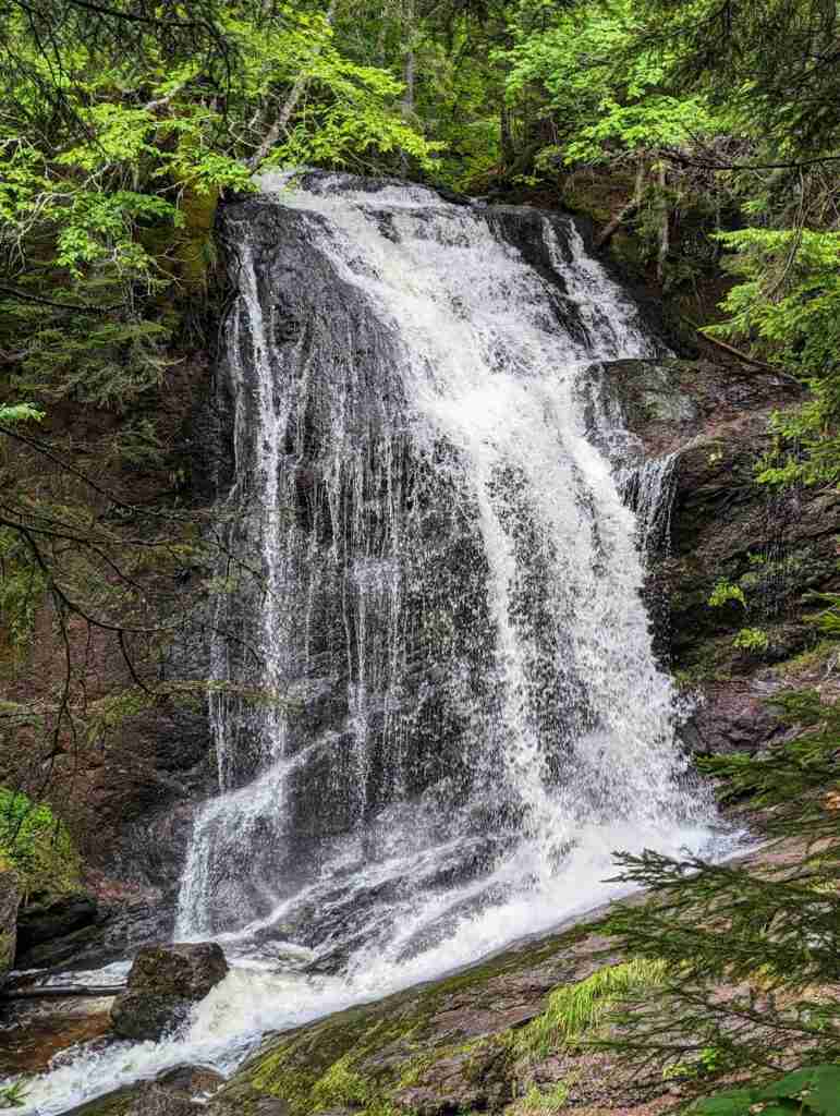 Fuller Falls cascading down rock wall in the forest