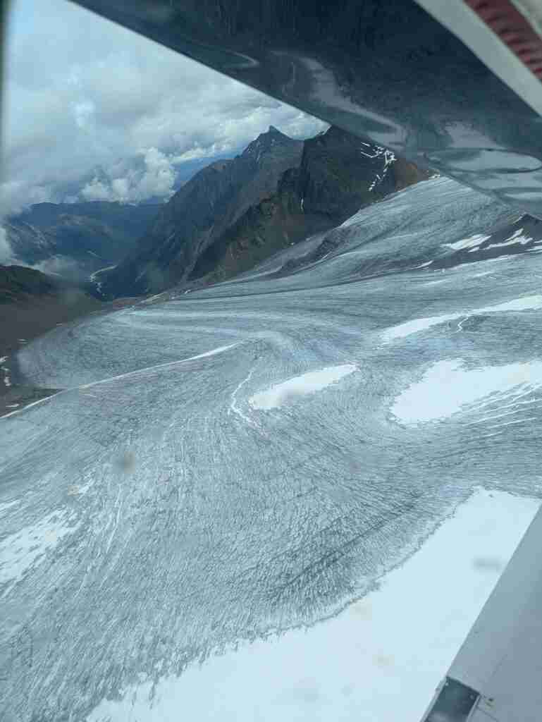 Glacier spreading down between two touring mountains of the Cirque of the Unclimbables