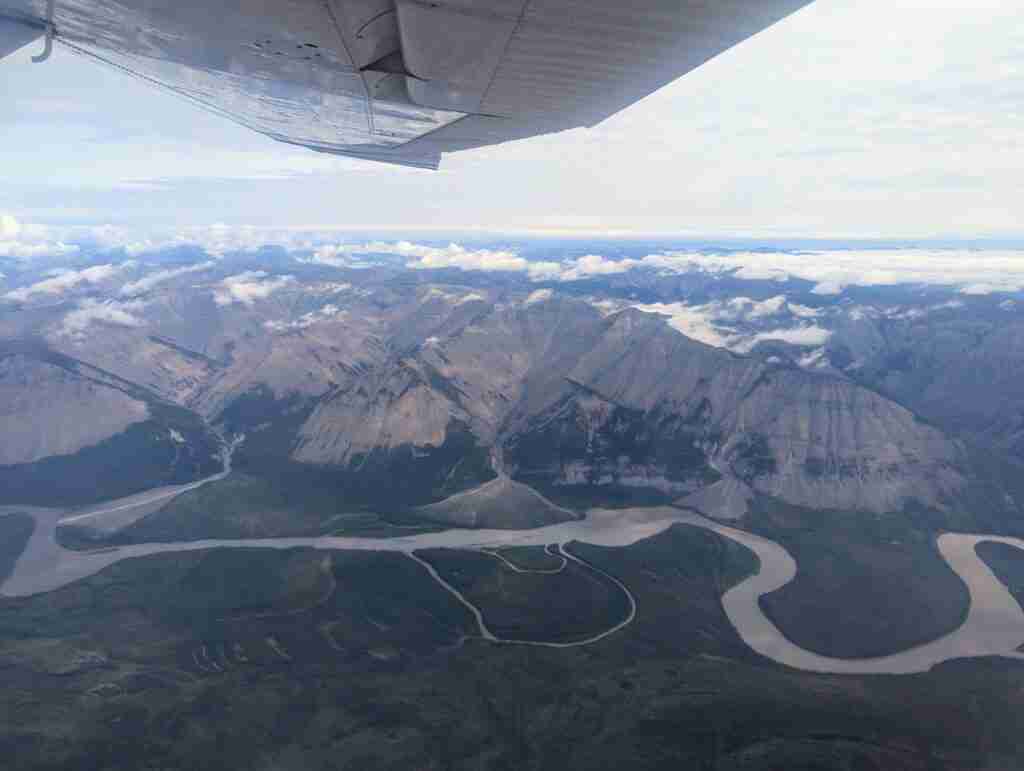 View of the montains and the winding river in the valley from a flightseeing tour of Nahanni National Park