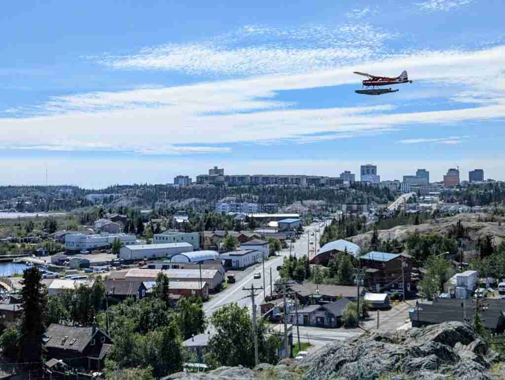 Float plane flying above the city of Yellowknife