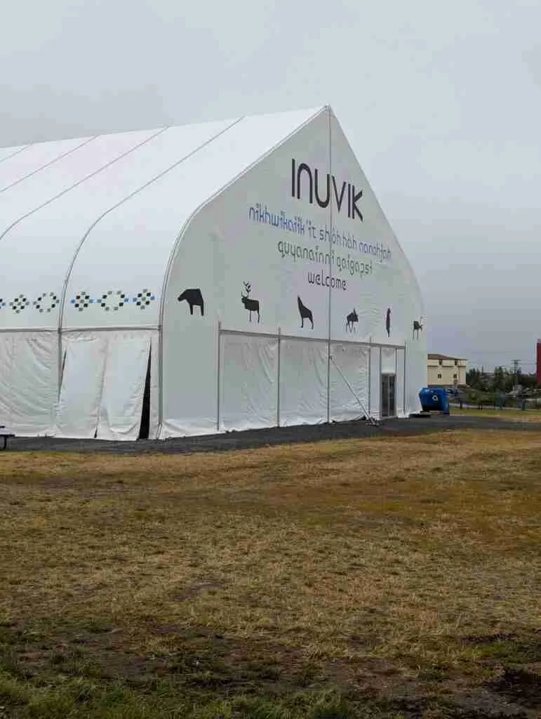 white tent with Inuvik welcome message written on it